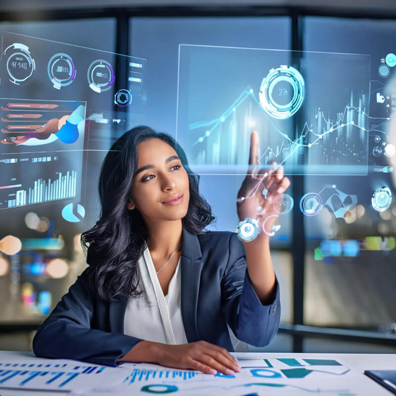 woman sitting with financial charts and futuristic computer
